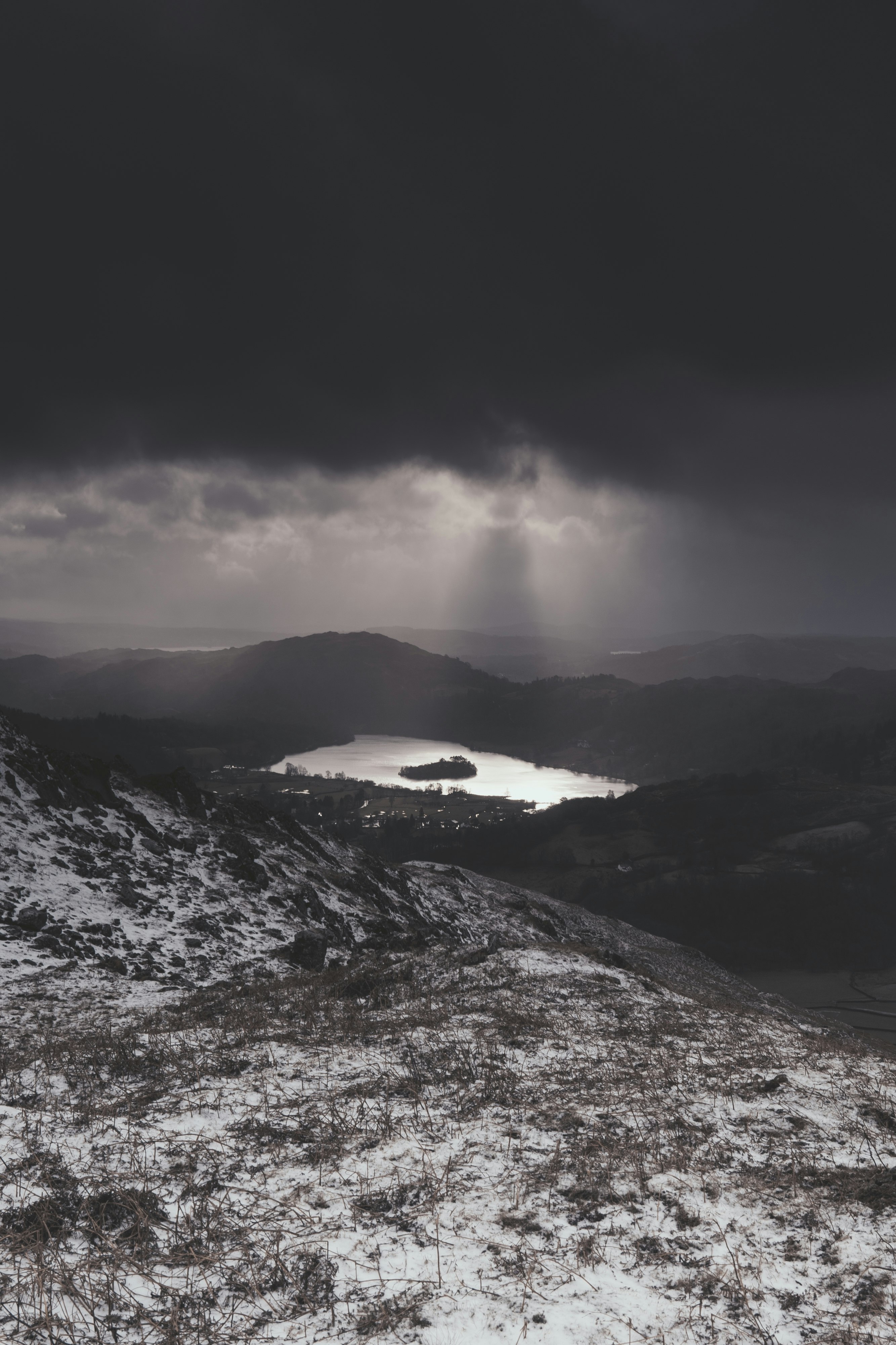 snow covered mountain under cloudy sky